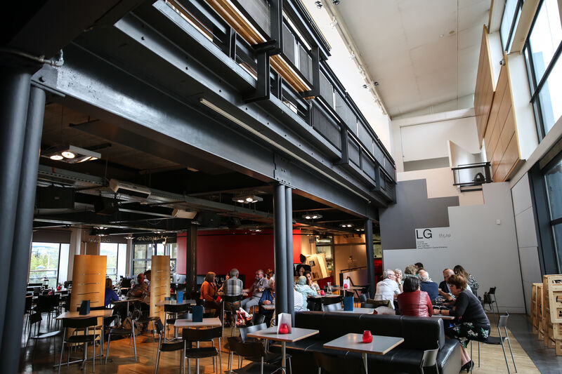 Wide view of people sitting at tables in Jute Cafe Bar