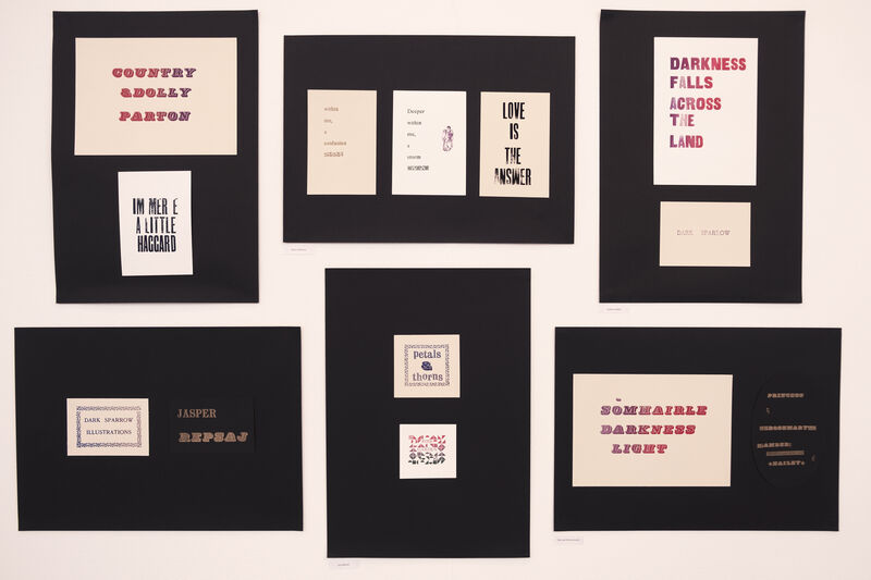 Display of letterpress prints on the wall of Gallery 1 for Spring Holiday Pop-up