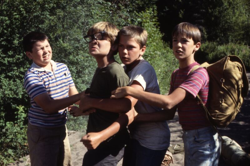 Four teen boys prepare for a fist fight with an unseen foe in the forest.