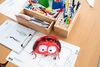 Creative materials and activity sheets on a table