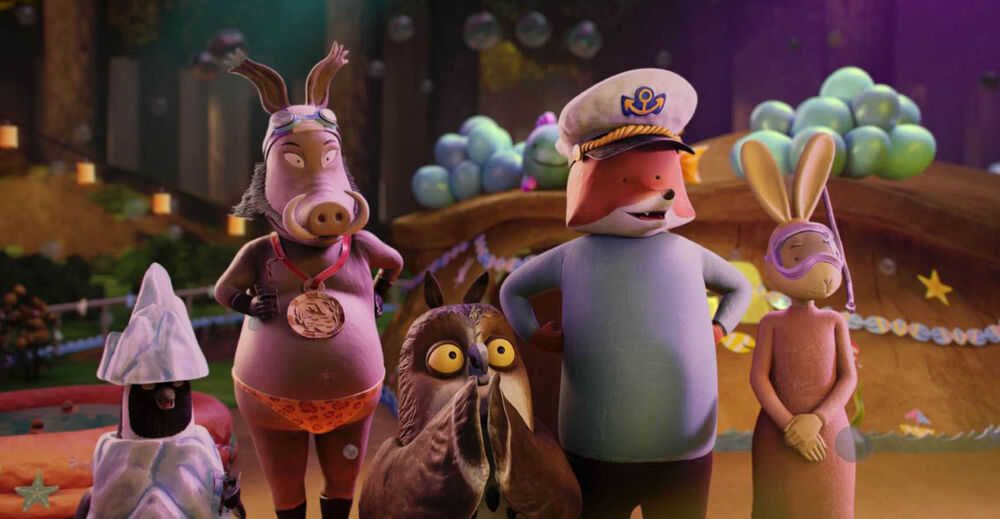A group of animated anthropomorphic creatures stand together - a penguin, warthog, owl, fox and rabbit.