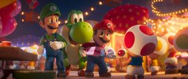 Luigi, Mario and dinosaur Yoshi meet cute little character Toad in The Super Mario Galaxy Movie.