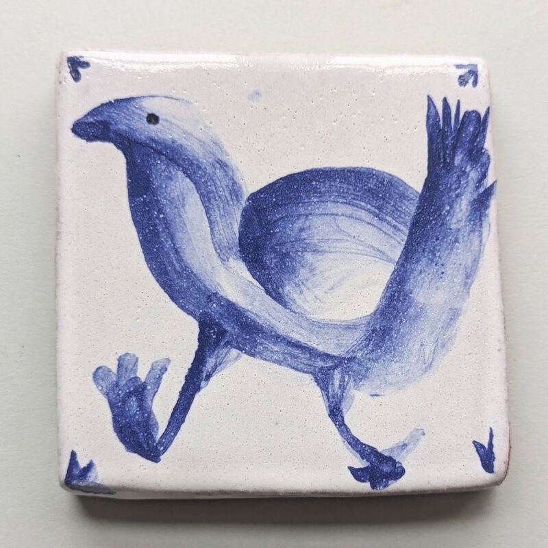Tile painted with blue bird
