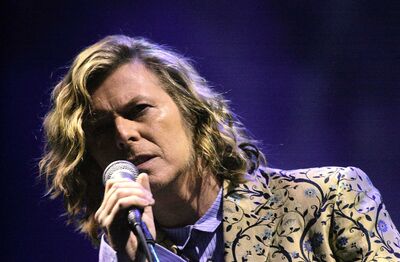 David Bowie performs on stage