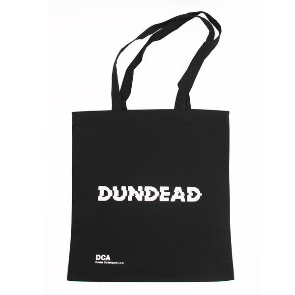 Black tote bag with white Dundead logo in the centre and DCA logo at the bottom left corner