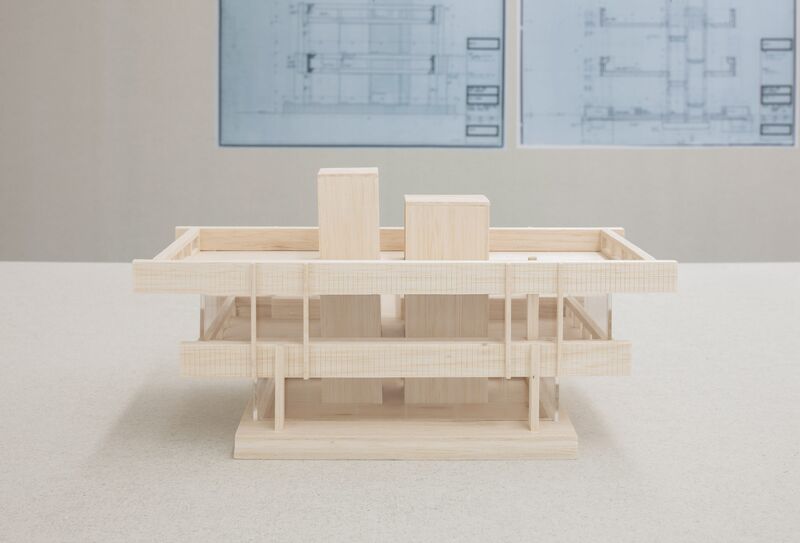 A small architectural model made out of wood.