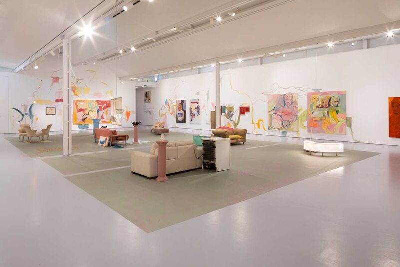 A gallery view, with furniture in the centre of the space and around the galleries 