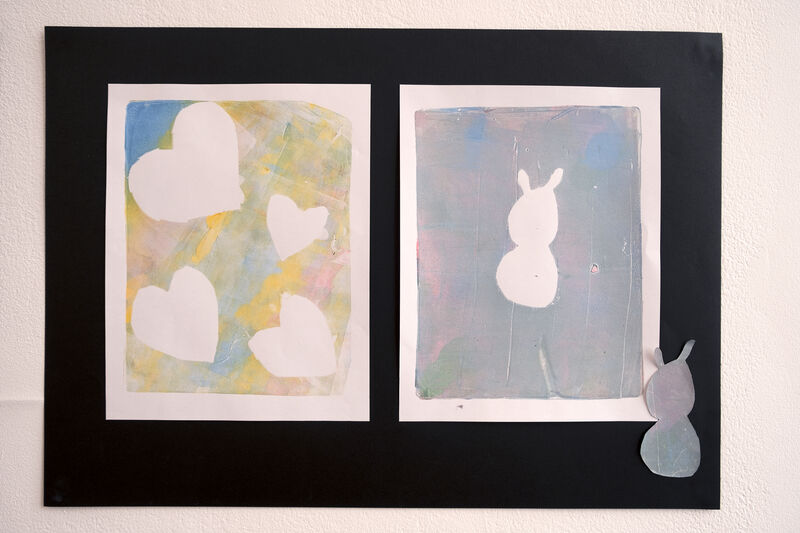 Two prints, one of hearts and one of a rabbit
