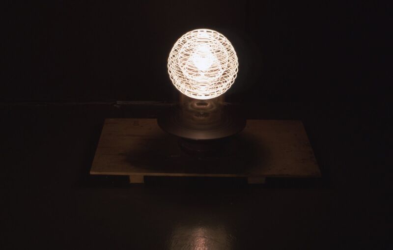A spherical structure with white light emanating from it. 