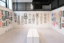 Centrespace 1 with framed prints on the wall and benches in the middle of the room