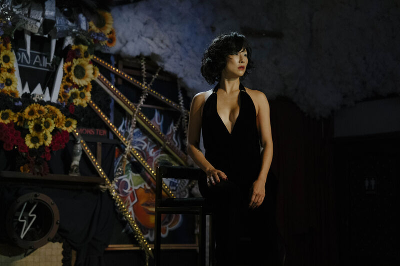A woman stands on stage