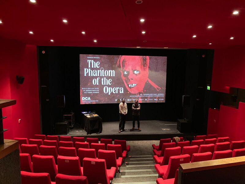  Andrew Wasylyk and Tommy Perman on the stage at Eden Court in front of The Phantom of the Opera Screen slide 