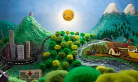 A sunny and mountainous landscape made out of felt