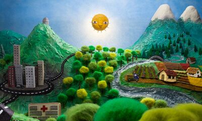 A sunny and mountainous landscape made out of felt
