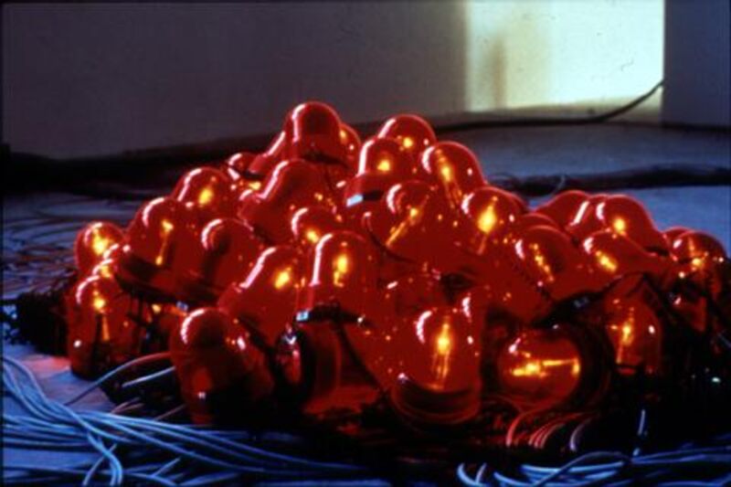From Trauma in DCA Galleries. A large clump of orange light bulbs.