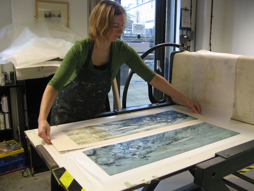 Liz Myhill printing on a press in DCA Print Studio