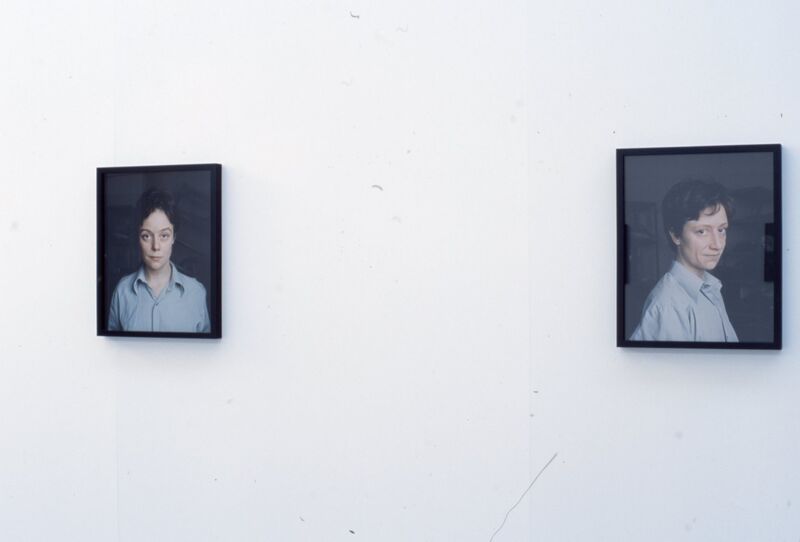 Small framed photographs of a person in a blue shirt.