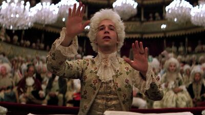 Mozart directs the orchestra in a grand concert hall.