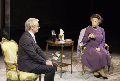 Helen Mirren plays the Queen, sitting on a chair next to the prime minister having a conversation