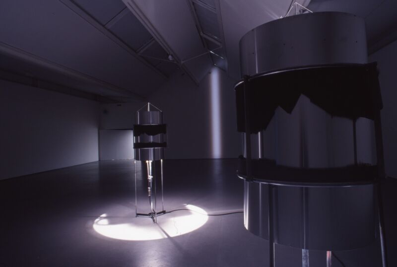In DCA Galleries, there are two metallic, rocket shaped objects sitting in the middle of the room.