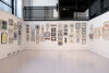 Centrespace with walls covered in framed prints