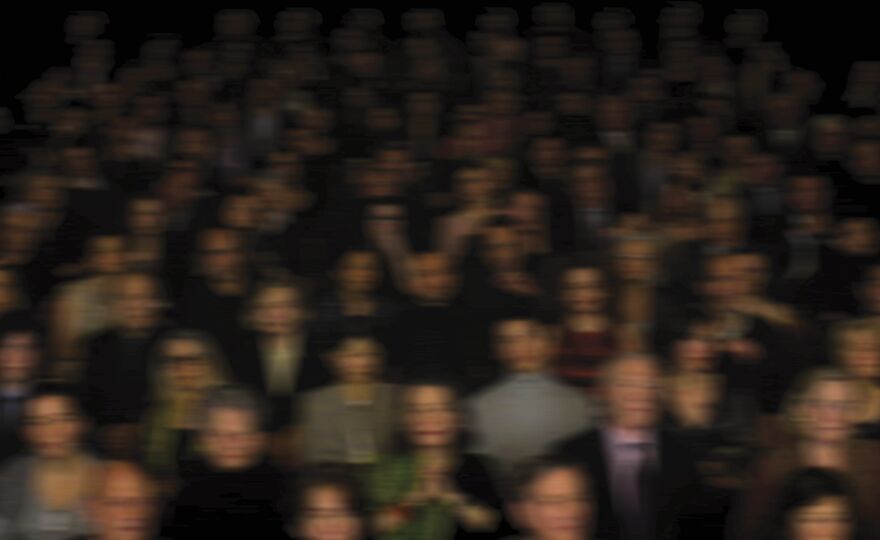 Blurry image of a crowded cinema