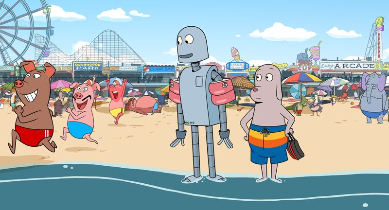 A cartoon still of a robot wearing armbands and a dog in swimtrunks standing in the sea on a crowded beach with a fairground in the background.