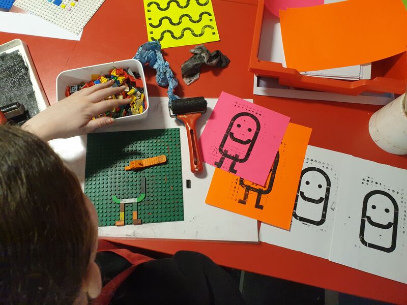 Pupil creating Lego Dot prints