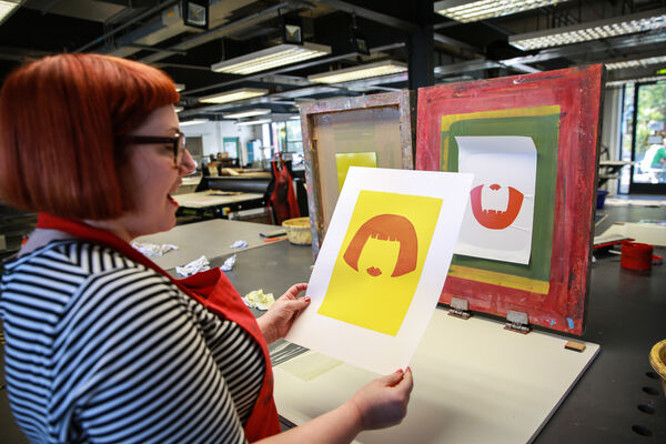 Person showing their screen print