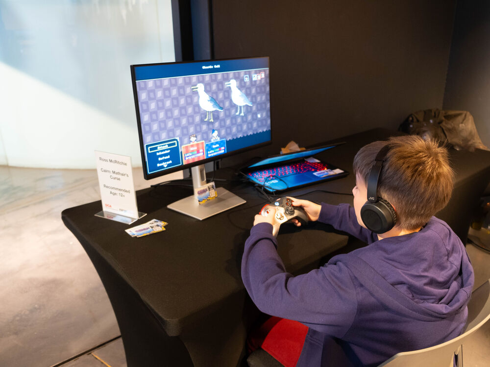 A boy plays a seagull game at Drop in and Play