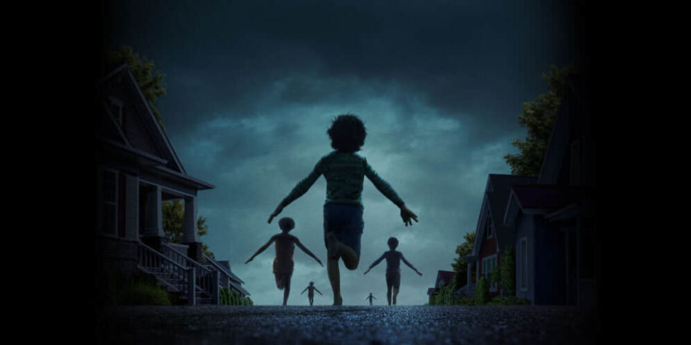 Children run down a dark street with their arms stretched out