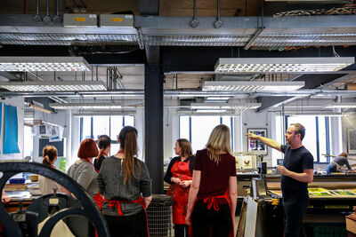 Group of people beaing shown around DCA Print Studio