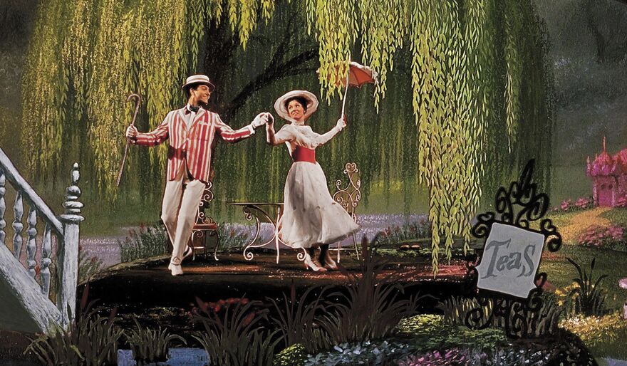Mary Poppins wears a white dress and dances in a set that looks like a garden.