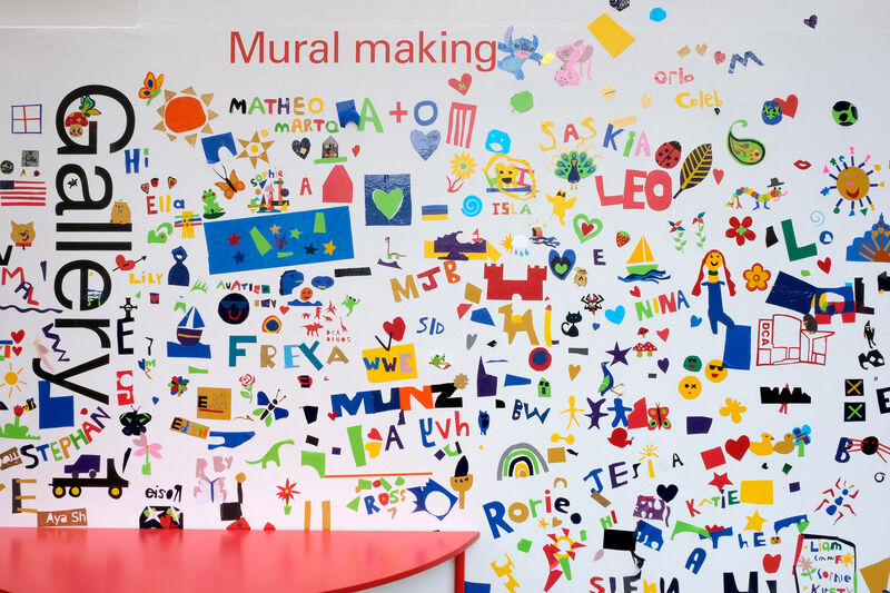 Mural making wall covered in vinyl artwork