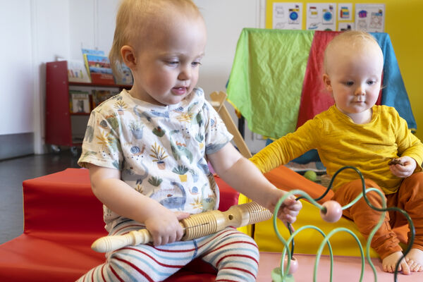 Two children playing with toys at Stay and Play