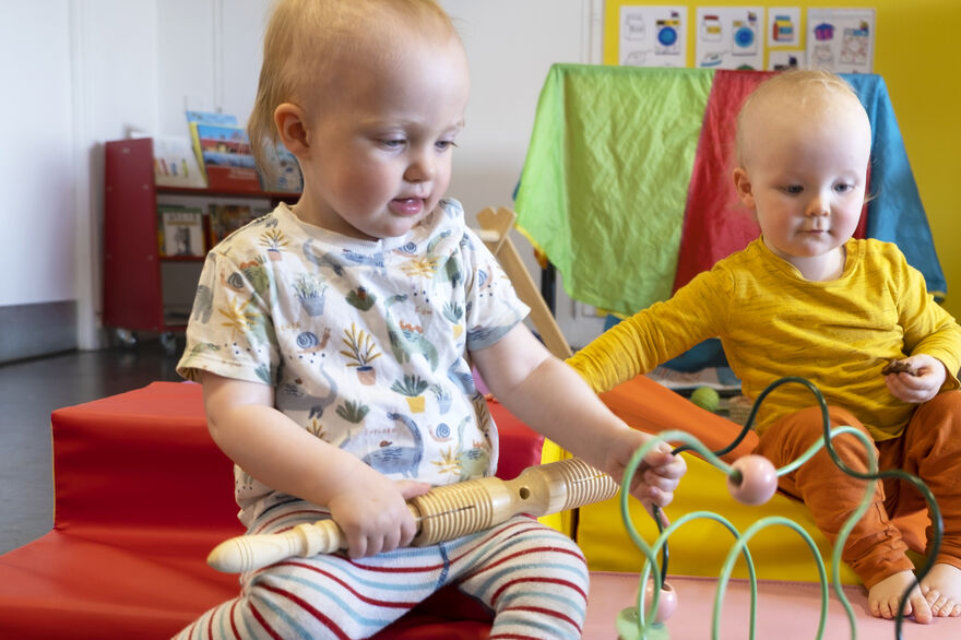 Two children playing with toys at Stay and Play