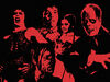 A red and black image of Halloween characters including Phantom of the Opera' Frank 