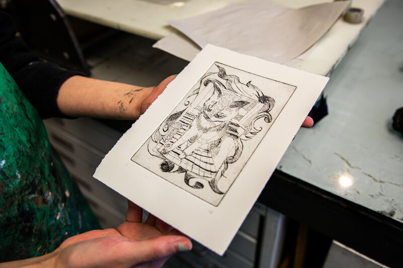Morgan Academy pupil showing an etching print of a cat