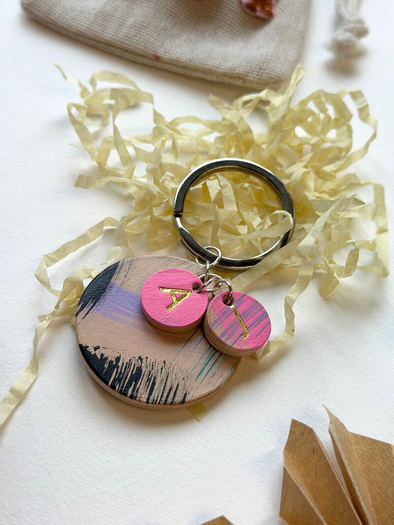 Leather keyring with painted marks and gold initials