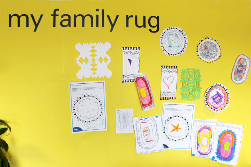 My Family Rug activity wall in DCA Create Space showing lots of rug designs created by visitors to the space