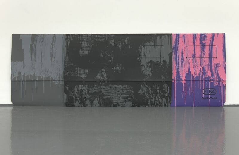 An oversized manilla document folder, which has been scaled up to be the same size as a person. It is painted grey, pink and purple. From Scott Myles' exhibition in 2012.