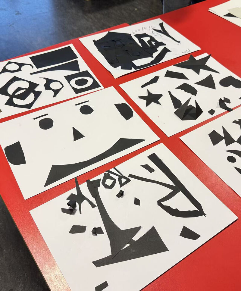 Collection of collages on a red table