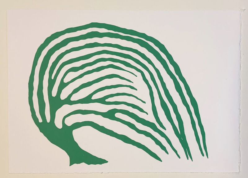 A green fossil like print on off white paper 