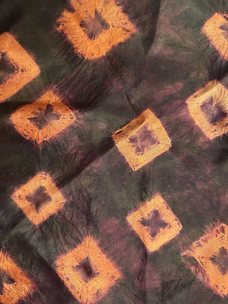 Purple / black silk scarf with orange Shibori pattern
