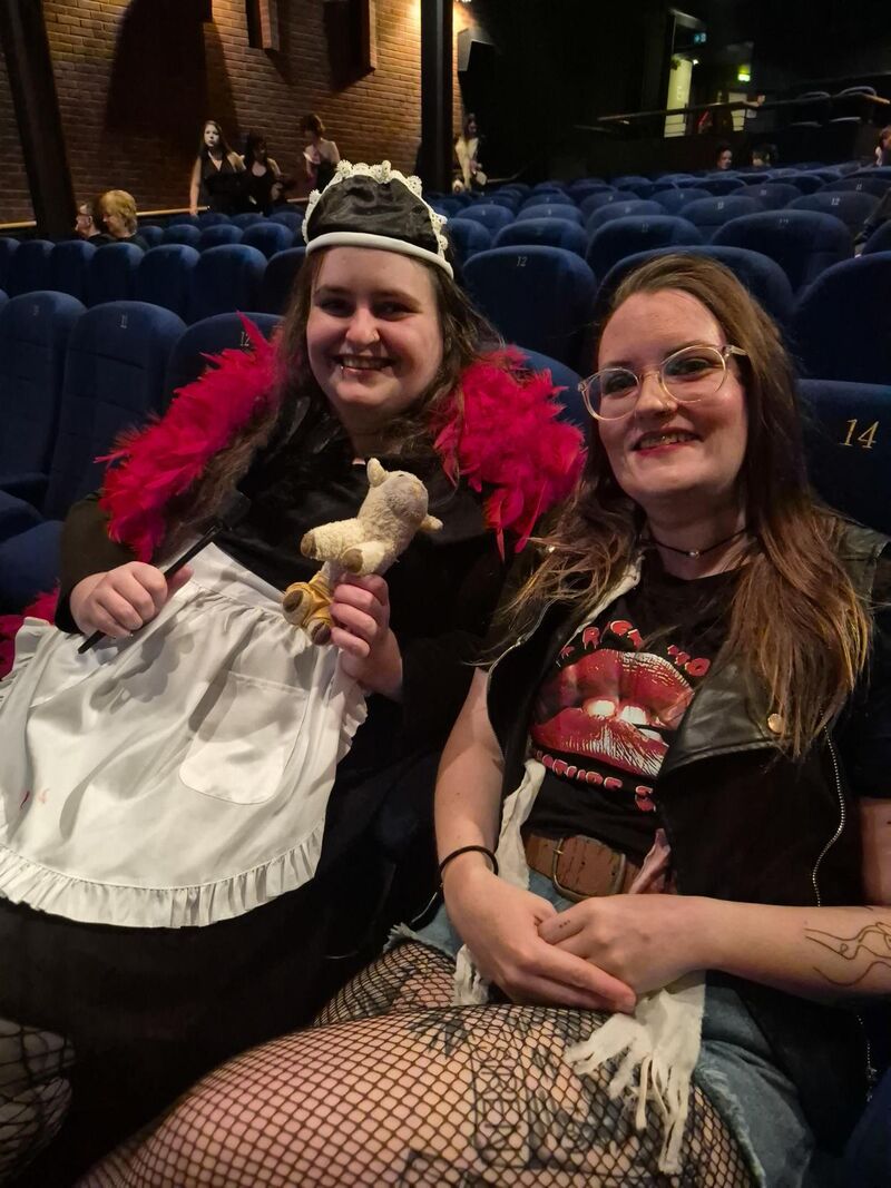 People dressed up in the audience of The Rocky Horror Picture Show