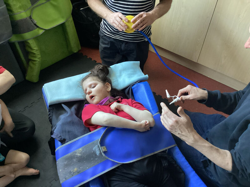 Child testing an arm pump