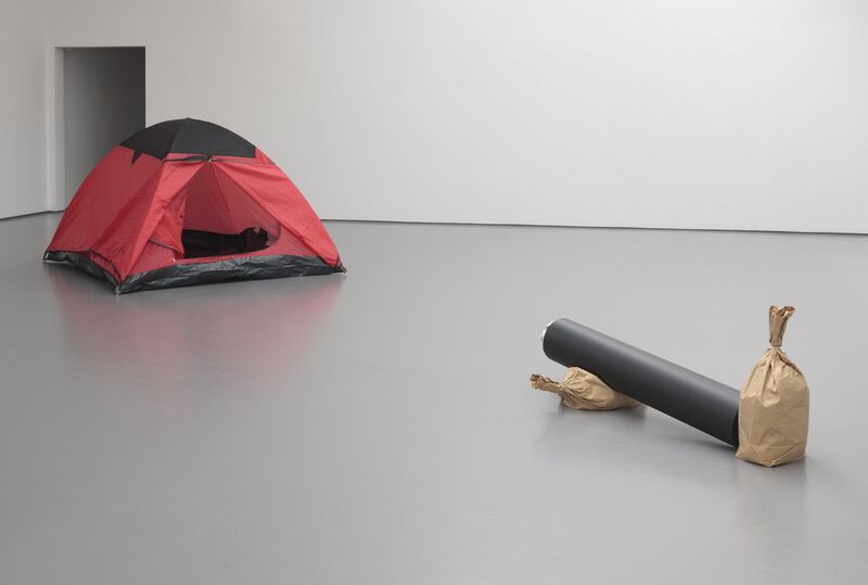 DCA Galleries during Roman Signer's exhibition. a steel cannon is pointed at an open tent 