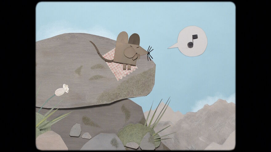 A small mouse sits on a blanket on top of a rock, whistling. A speech bubble with a musical note inside appears