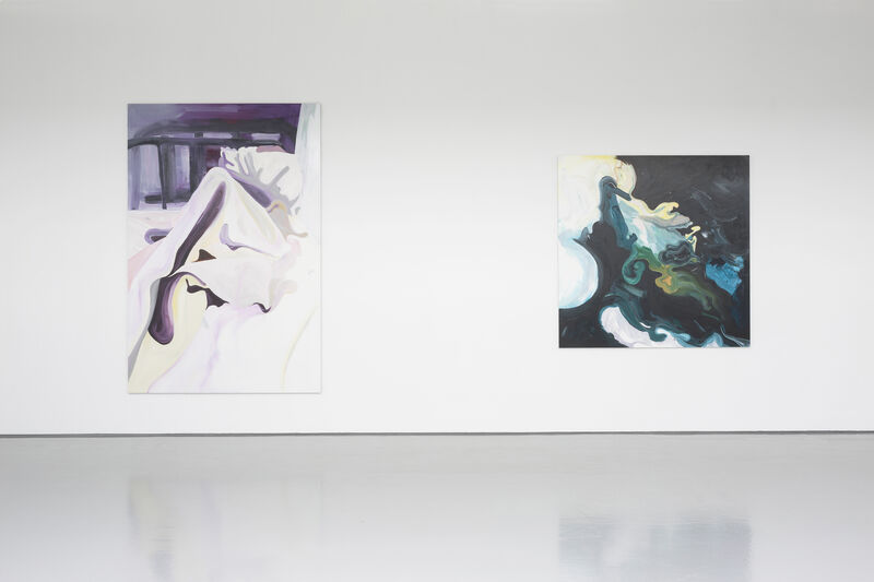 Installation view of a gallery with bright natural light and white walls. We can see two paintings from a distance. The paint strokes are bold and broad. 