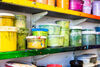 Yellow and green inks on shelves in DCA Print Studio